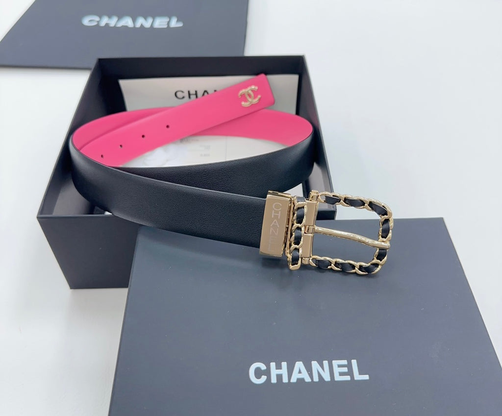 Chanel belt with navy leather and hot-pink lining, gold-tone buckle with chain links.