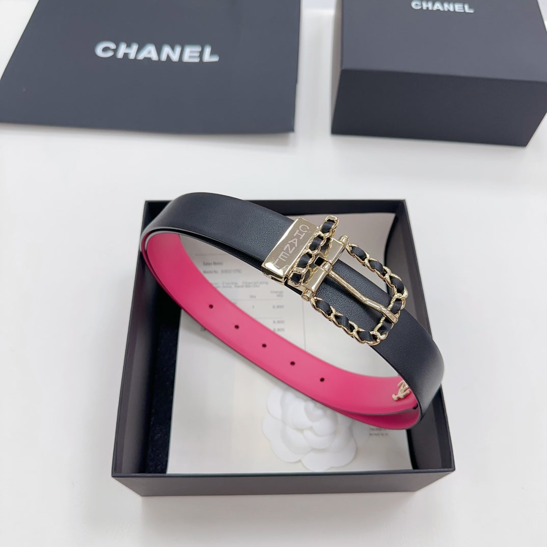 Chanel belt, dark navy leather with hot-pink inner strap and gold-tone logo buckle.
