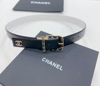 Leather belt with white strap and gold-tone CC buckle with chain link detail