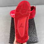 Red Jordan sneaker outsole with traction tread and Jumpman logo on heel