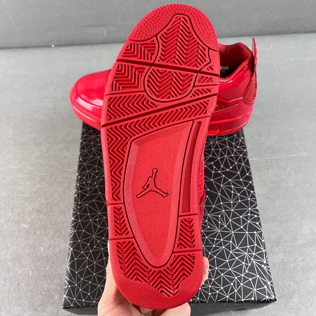 Red Jordan sneaker outsole with traction tread and Jumpman logo on heel
