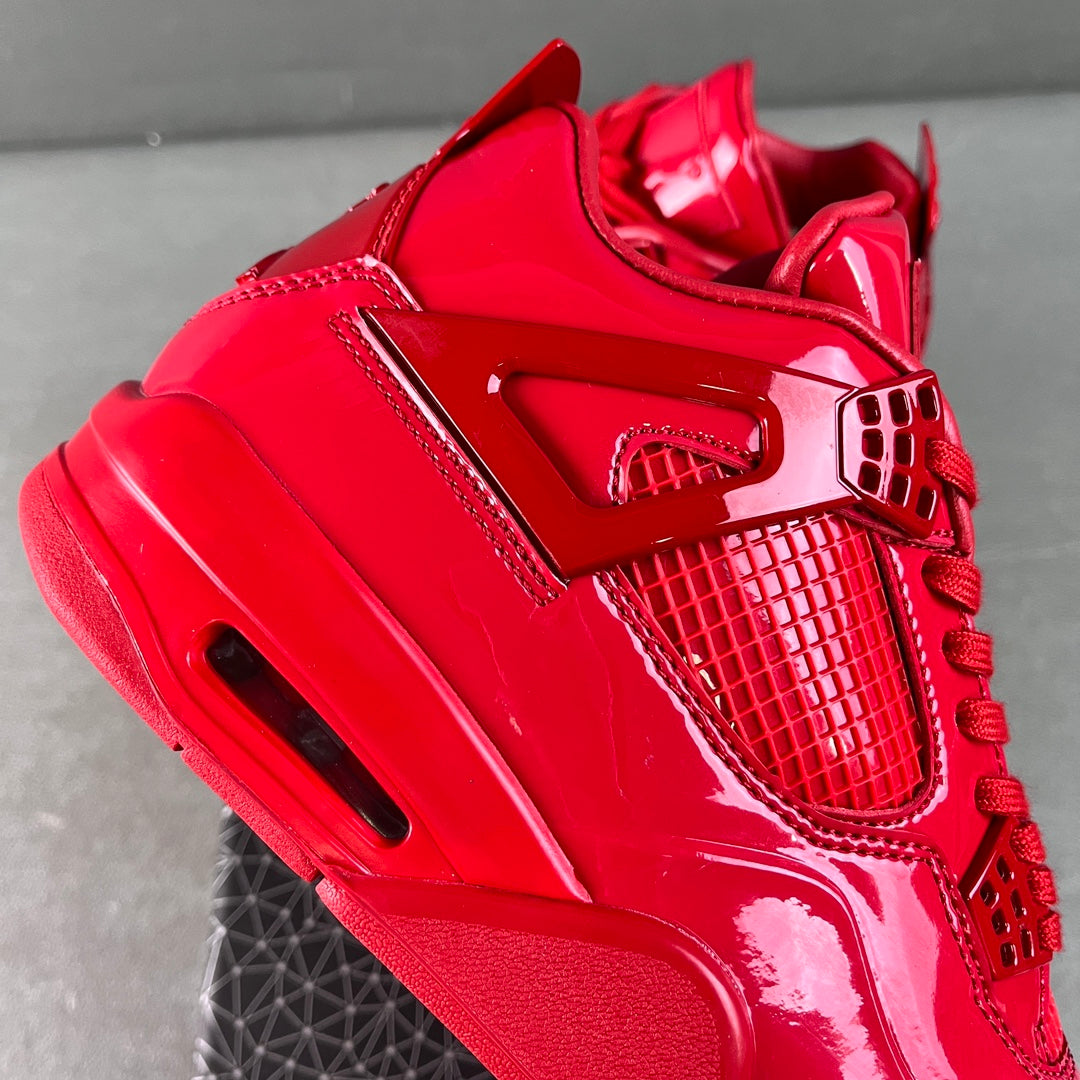 Red patent Jordan sneaker close-up of heel and side mesh panel
