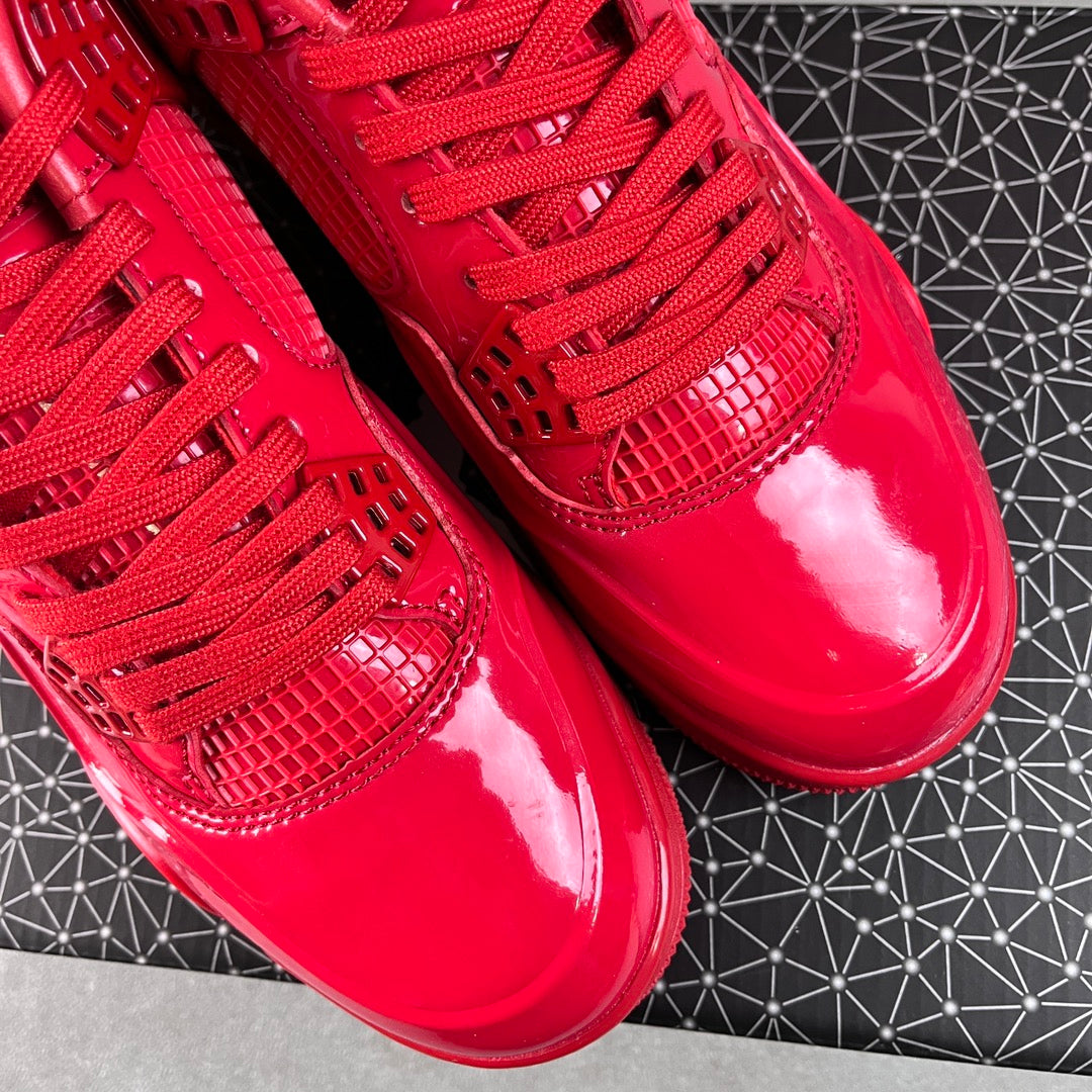 Red patent Jordan sneakers close-up of toe box and lace-up ties