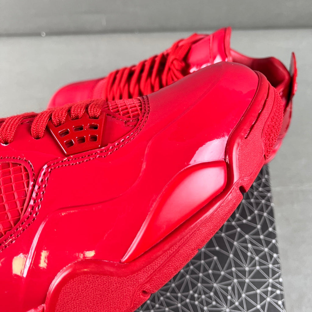 Red patent Jordan sneaker close-up of side panel and chunky sole edge