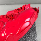 Red patent Jordan sneaker close-up of side panel and chunky sole edge