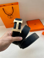 Hermes leather belt with H buckle, silver studded accents and gold-toned center, holes visible