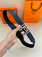 Navy leather belt with silver-tone double buckle, curved view