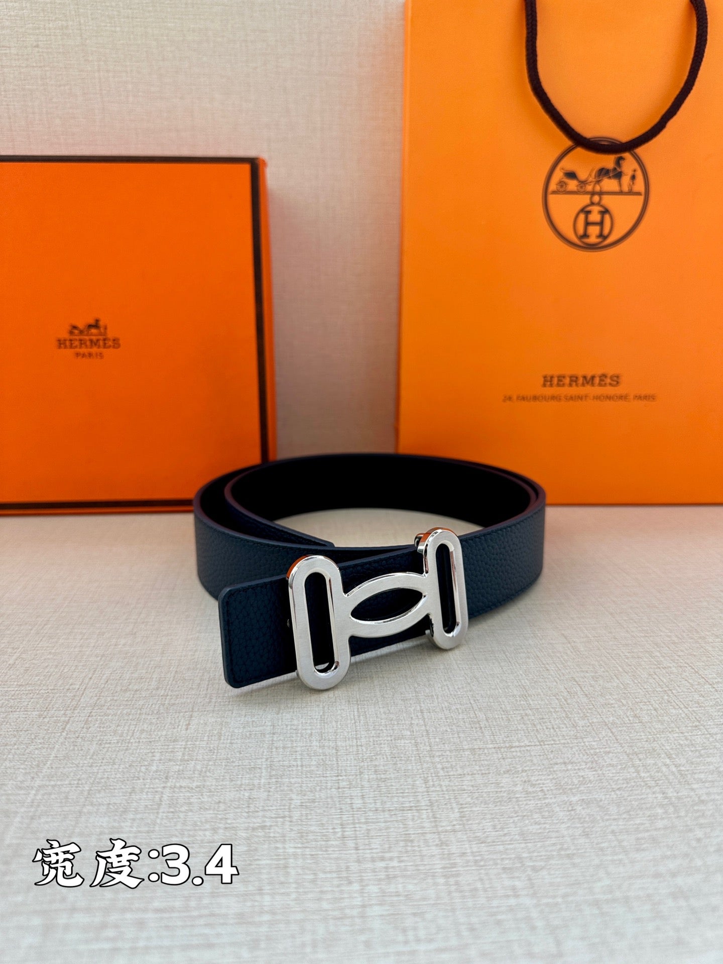 Hermes leather belt with dark blue strap and silver-tone H buckle