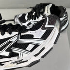 Balenciaga unisex sneaker, white upper with black mesh and lace-up, side detail