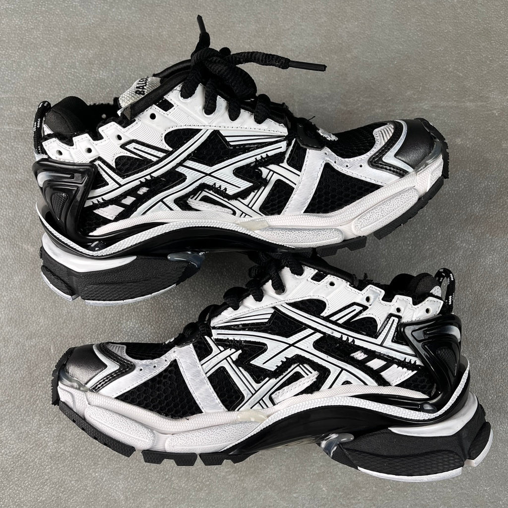 Balenciaga unisex sneakers, angled pair view, white and black, lace-up, chunky sole