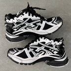 Balenciaga unisex sneakers, angled pair view, white and black, lace-up, chunky sole