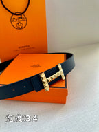Hermes leather belt with dark blue strap and gold-toned studded square buckle