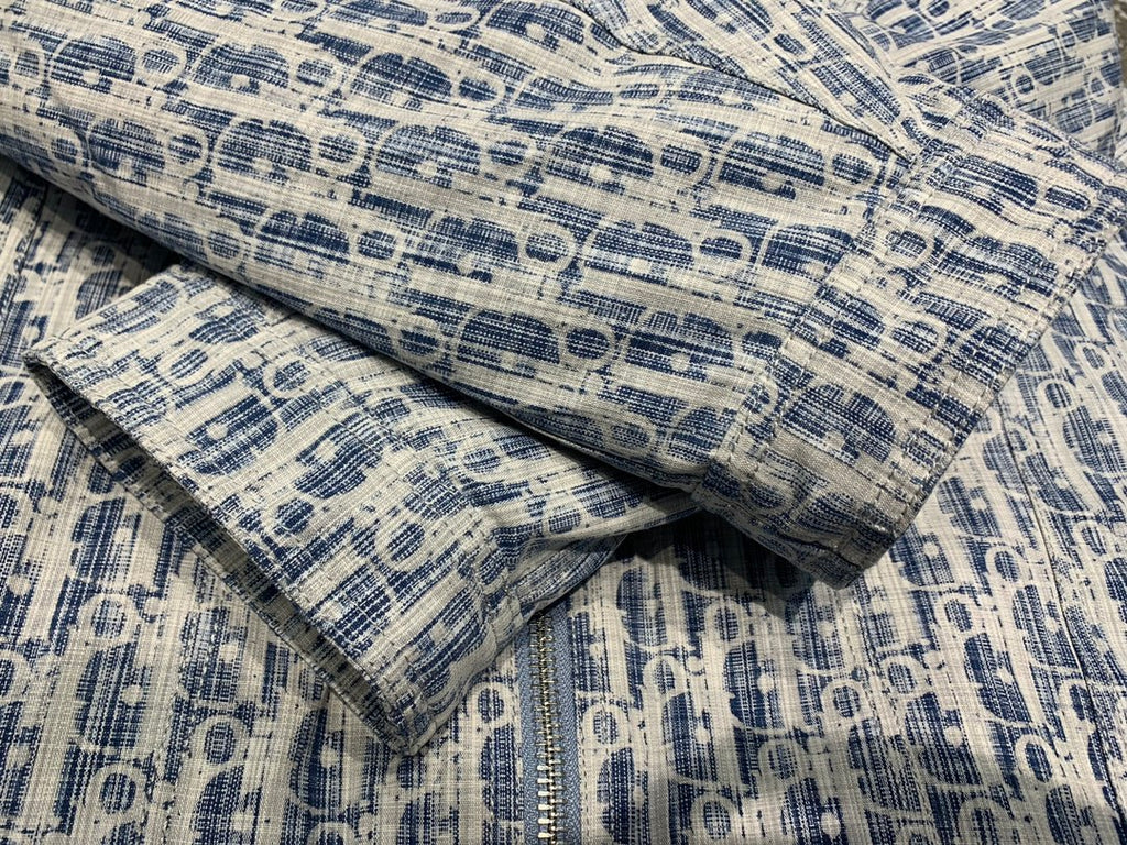 Blue and white patterned hooded jacket fabric detail with textured woven look