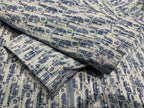 Blue and white patterned hooded jacket fabric detail with textured woven look