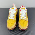 Yellow low-top sneakers with white laces and maroon heel trim, pair view.