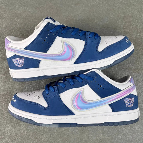 Pair of blue-and-white low-top sneakers with iridescent swoosh accents and lace-up design