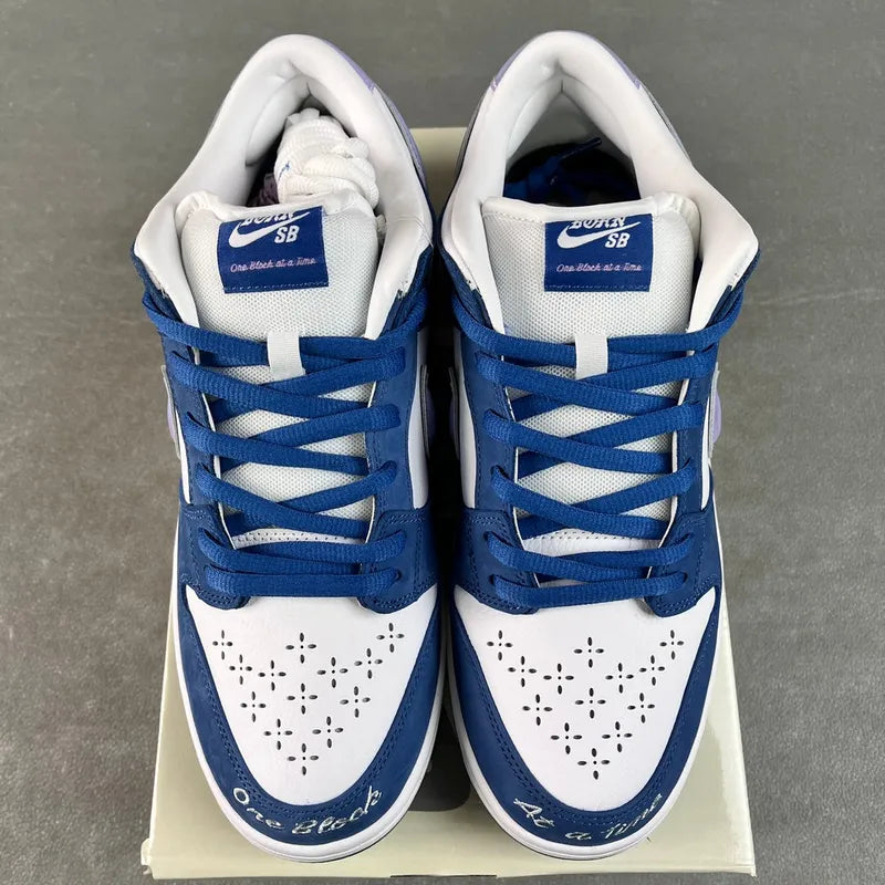 Heel view of blue-and-white low-top sneakers with Nike SB tongue labels