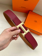 Hermes belt with burgundy leather strap and gold-tone buckle hardware