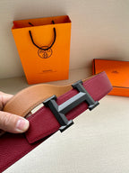 Hermes belt close-up with burgundy leather texture and silver-tone buckle
