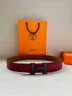 Hermes belt with burgundy leather strap and silver-tone rectangular buckle