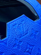 Blue embossed Louis Vuitton zip pouch bag interior lining and stitched opening