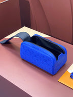 Blue embossed Louis Vuitton zip pouch bag with open top and dark interior lining