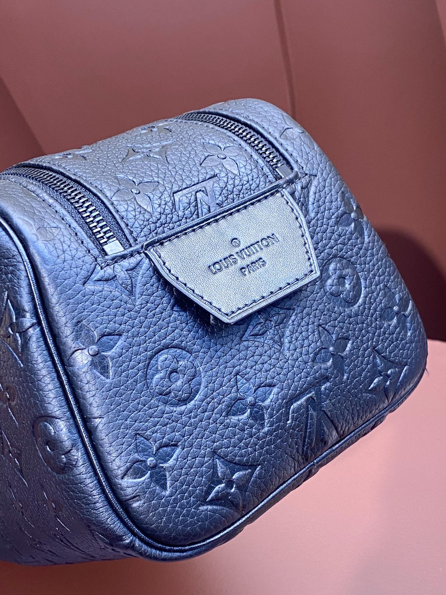 Louis Vuitton blue monogram leather belt bag with front brand patch and textured grain