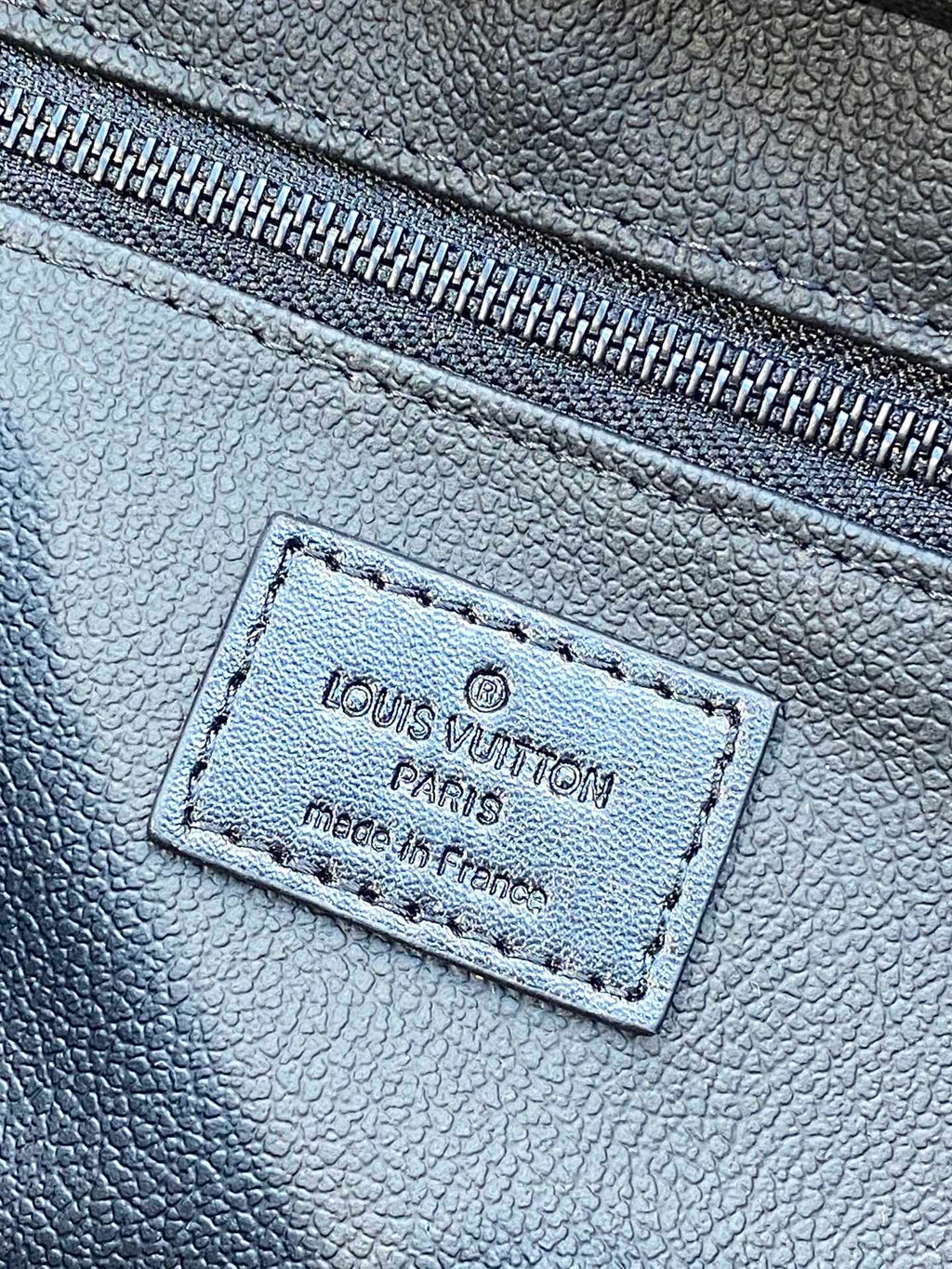 Louis Vuitton blue monogram leather belt bag with stitched front brand patch and zipper trim