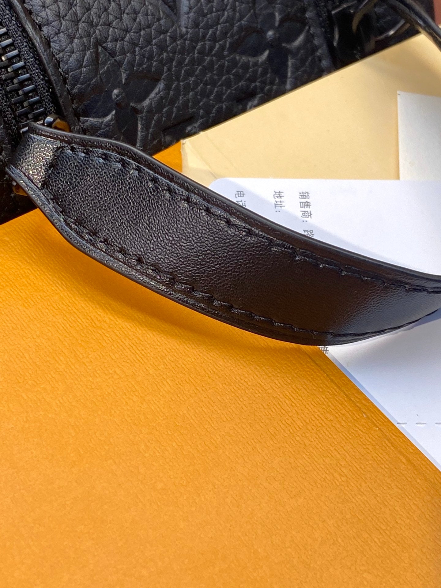 Louis Vuitton blue monogram leather belt bag underside with stitched lining and zip edge