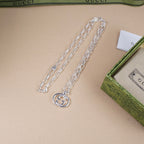 Silver-tone chain necklace with round interlocking GG pendant