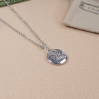 Silver heart pendant necklace with flower and Gucci logo engraving, on chain