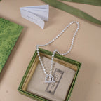 Gucci silver-tone necklace with ring and bar pendants
