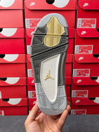 Light gray Air Jordan 4 sneaker outsole view with Jordan logo and patterned traction