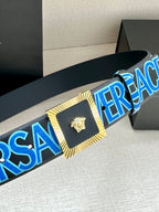 Versace logo belt close-up with blue lettering, gold center buckle, Medusa.