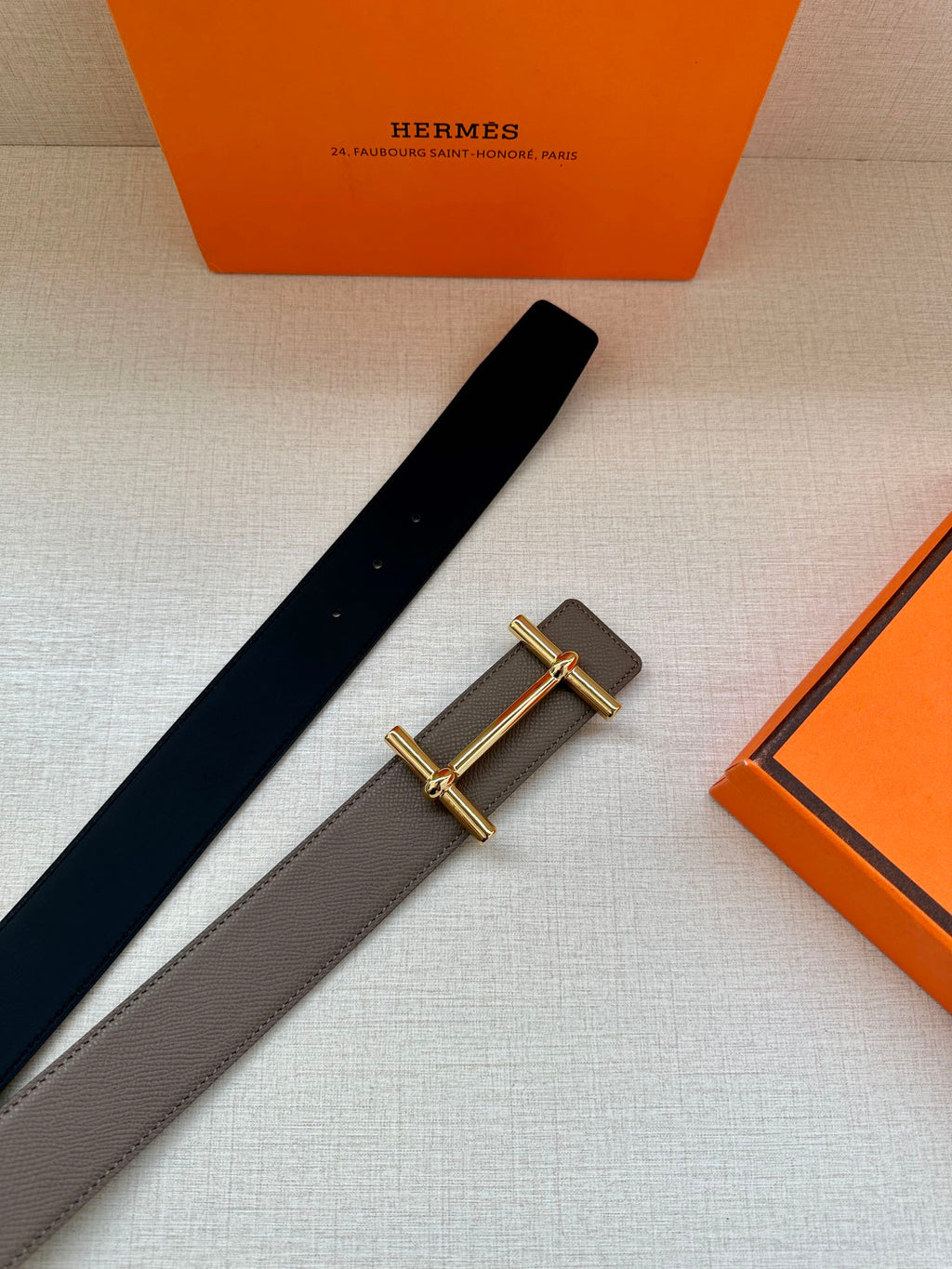 Gray and dark-brown leather belts with gold-toned double-bar buckle