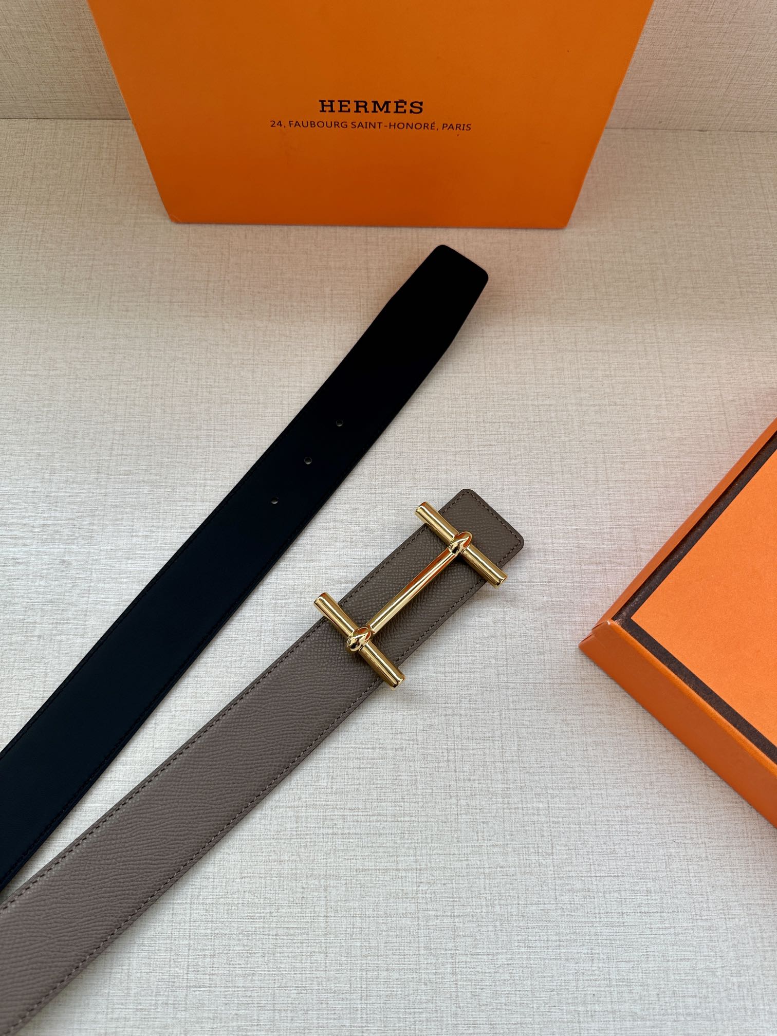 Gray and dark-brown leather belts with gold-toned double-bar buckle