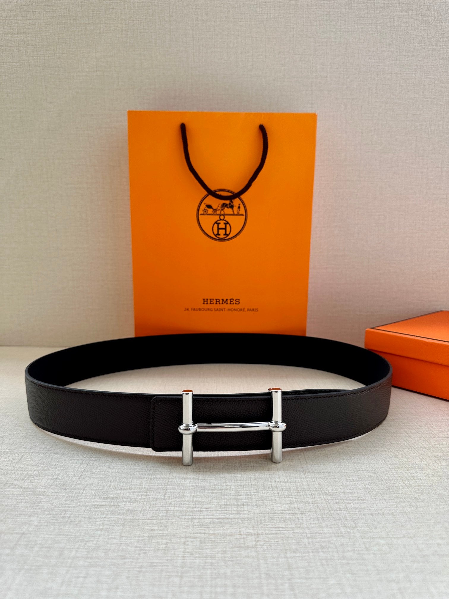 Hermes belt with dark leather strap and silver-tone double-bar buckle