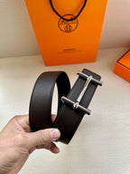 Hermes belt with dark leather strap and silver-tone double-bar buckle detail