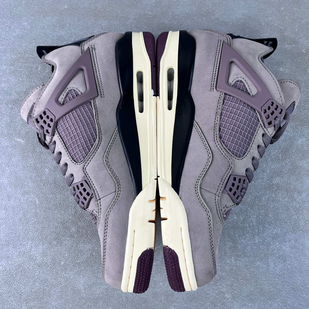 Grey Air Jordan 4 sneaker top view with laces, mesh panels, and side cutouts