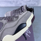 Grey Air Jordan 4 sneaker side detail with laces and mesh panel