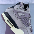 Grey Air Jordan 4 sneaker profile with lace-up front and mesh quarter panel
