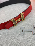 Red belt strap with silver buckle clasp and engraved center detail