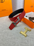 Red and black belt with silver H buckle; shown with gold and silver hardware