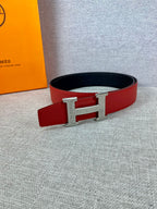 Red leather belt with silver H buckle and black lining