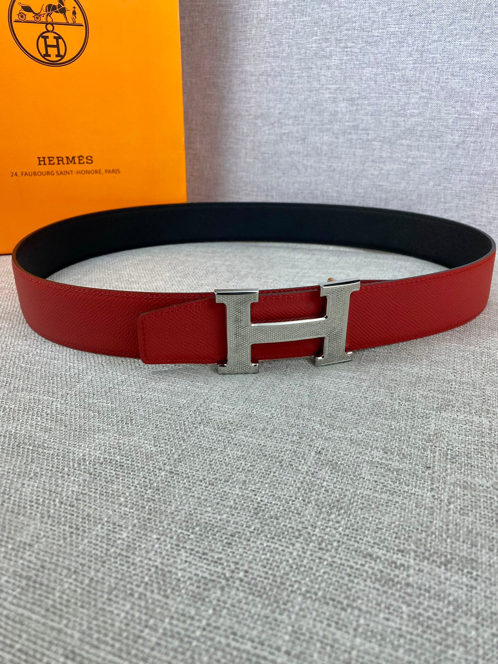 Red and black leather belt with silver H buckle