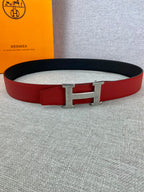 Red and black leather belt with silver H buckle