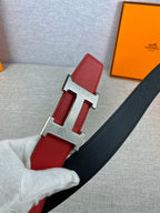 Red leather belt with silver H buckle and black trim