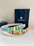 Versace belt with turquoise and green patterned strap, silver-tone buckle.