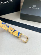 Versace belt laid flat with blue and gold patterned strap and gold-tone square buckle.