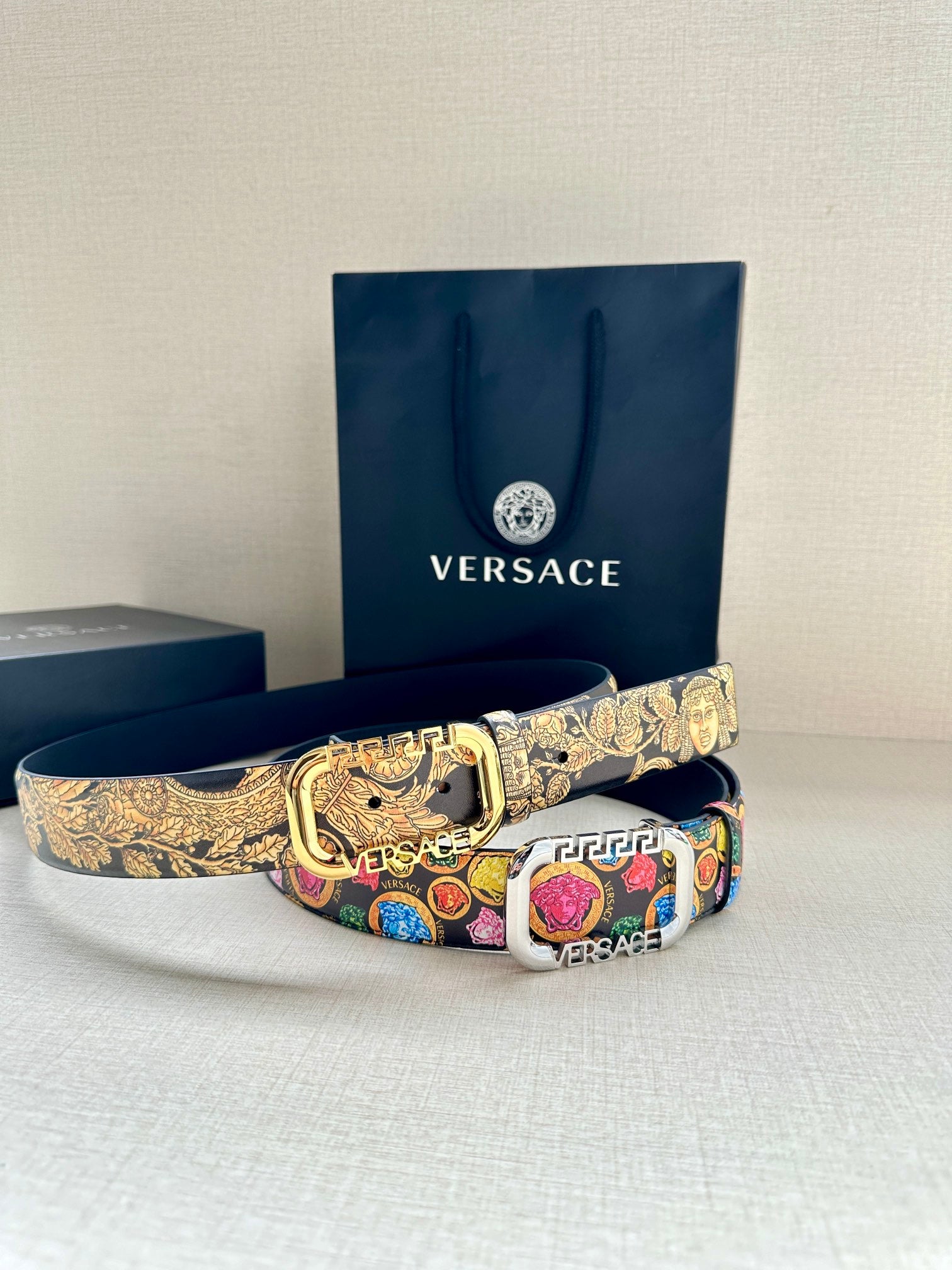 Versace belt with gold-tone patterned center and multicolor medallion strap